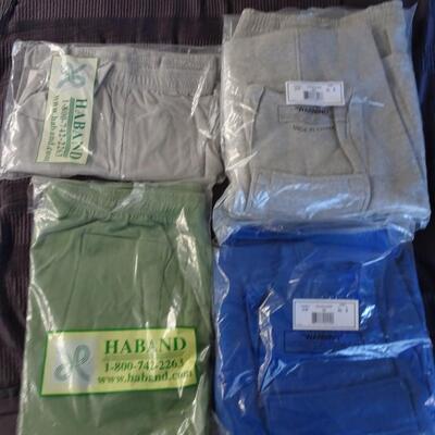 LOT 528. 2  XL SWEAT PANTS SHORTS  AND 2 SHORTS  STILL IN PACKAGE
