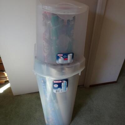 LOT 560. GIFT WRAP STORAGE AND SOME GIFT WRAP