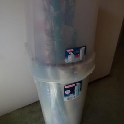 LOT 560. GIFT WRAP STORAGE AND SOME GIFT WRAP