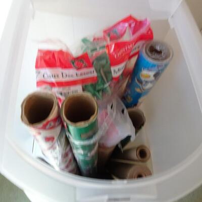 LOT 560. GIFT WRAP STORAGE AND SOME GIFT WRAP