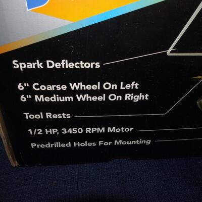 LOT 584. BENCH GRINDER STILL IN BOX