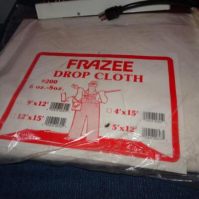 LOT 589. TWO DROP CLOTHS IN PACKAGE AND EXTENSION CORDS