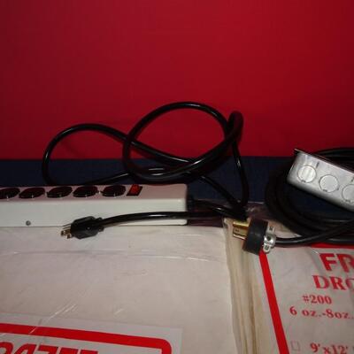LOT 589. TWO DROP CLOTHS IN PACKAGE AND EXTENSION CORDS