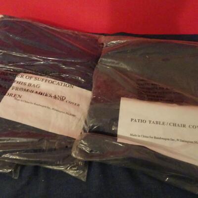 LOT 612. FOUR PATIO CHAIR COVERS