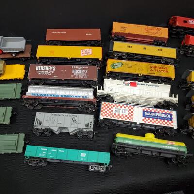 Penn Central HO Scale Model Train cars and signage