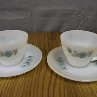 2 tea cups with small plates