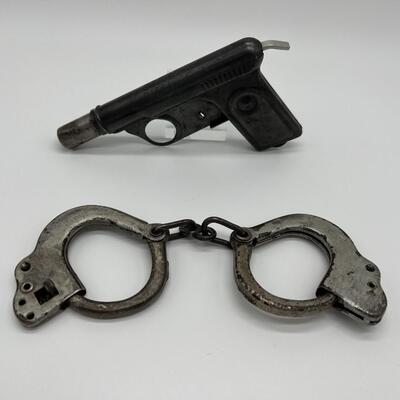 Lot of 1920s Toy Kids Cast Iron Handcuffs and 1928 Daisy No 71 Repeater Water Gun