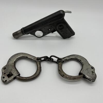 Lot of 1920s Toy Kids Cast Iron Handcuffs and 1928 Daisy No 71 Repeater Water Gun