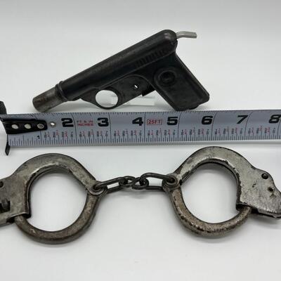 Lot of 1920s Toy Kids Cast Iron Handcuffs and 1928 Daisy No 71 Repeater Water Gun