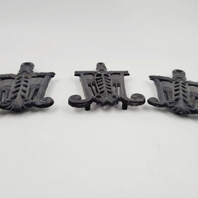 CAST IRON TRIPLE SET OF TRIVETS