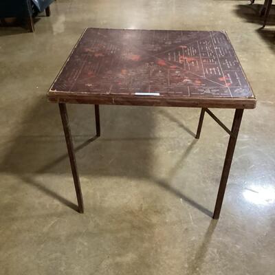 Card table with vintage Hartselle advertisements