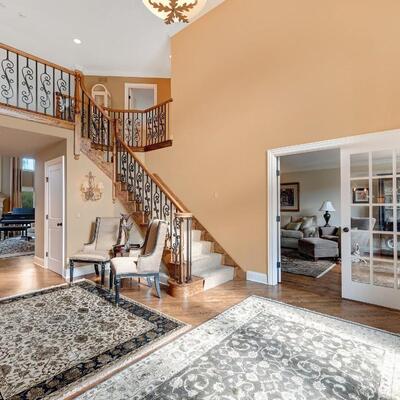 Two elegant high end arm chairs and a side table