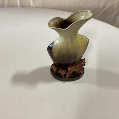 ceramic vase with dogs