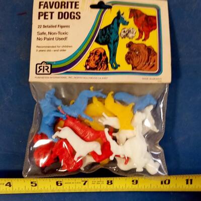 LOT 8   OLD PACKAGE OF PLASTIC TOY PET DOGS