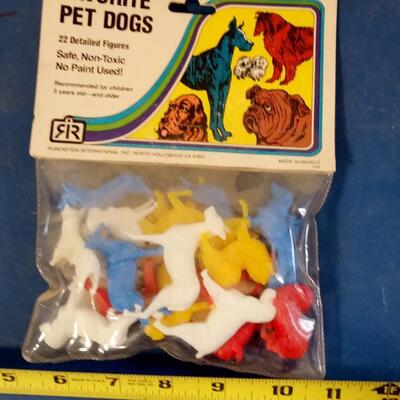 LOT 8   OLD PACKAGE OF PLASTIC TOY PET DOGS