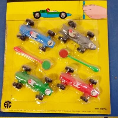 LOT 9   VINTAGE TOY MAGNETIC RACING RACERS