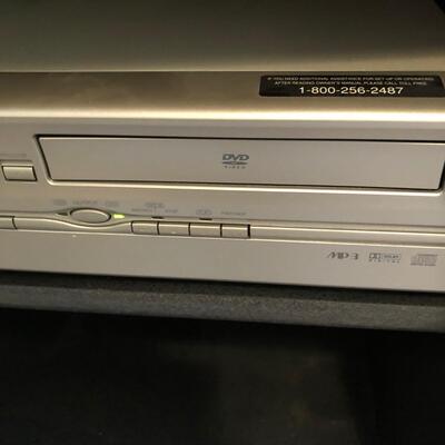 Emerson DVD & VHS Player w/ VHS tapes & DVDs (UR-KM)