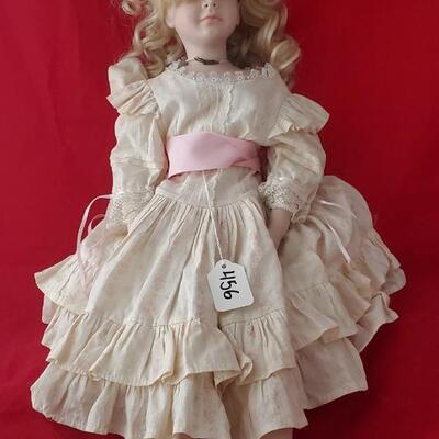 Doll in white and pink dress