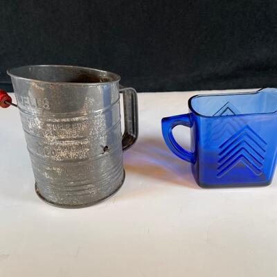 Lot 32. Antique Sifter and Milk Pitcher