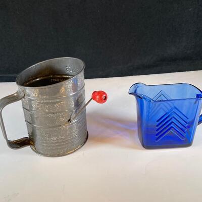 Lot 32. Antique Sifter and Milk Pitcher