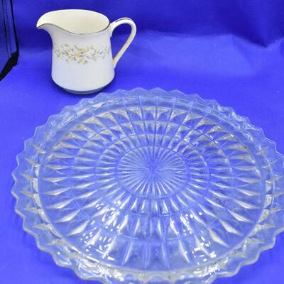 Clear plate with small creamer w/ yellow flowers