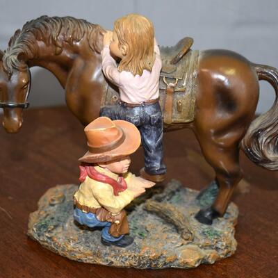Horse and boy/girl statue