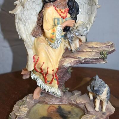 Indian with wolf Statue
