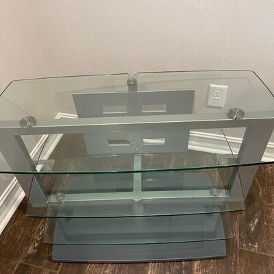 Lot 193. Glass & Steel TV Stand -- it swivels