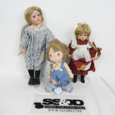 3 Dolls: 1-Precious Moments Cloth Doll, 2 Porcelain Dolls, 1 Has A Broken Hand