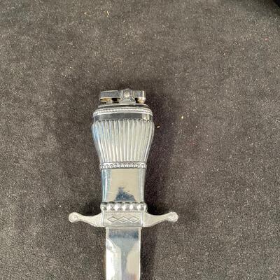 Lot 207A.   Miniature Armor Radio and Dagger Lighter