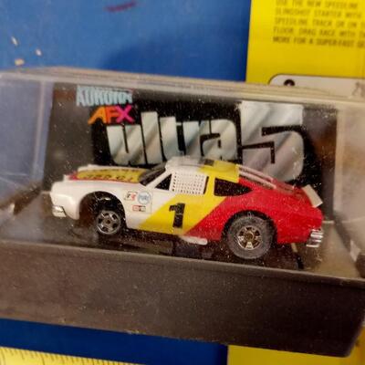 LOT 92   VINTAGE AURORA RACE CARS AND OBSTACLE