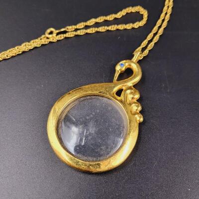 AVON SWAN MAGNIFYING GLASS NECKLACE
