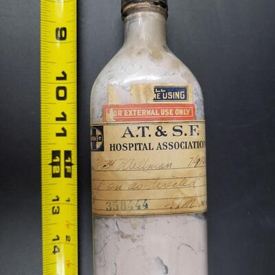 AT & SF ANTIQUE MEDICINE GLASS BOTTLRN
