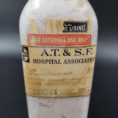 AT & SF ANTIQUE MEDICINE GLASS BOTTLRN