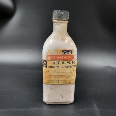 AT & SF ANTIQUE MEDICINE GLASS BOTTLRN