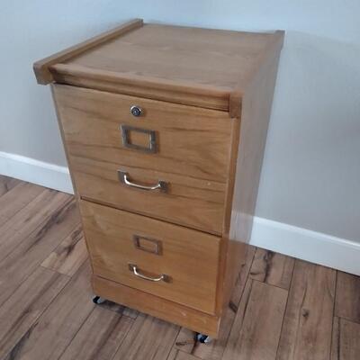 LOT 7 WOOD FILING CABINET WITH KEYS ON CASTERS