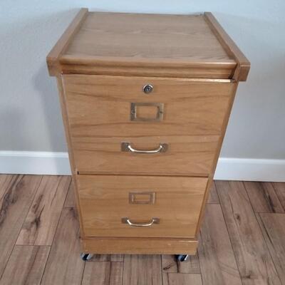 LOT 7 WOOD FILING CABINET WITH KEYS ON CASTERS