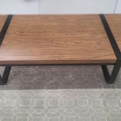 Modern wood and metal cocktail table 
H13" W55" D28"
$299