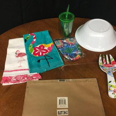 home decor: flamingo home decor: picture, salad bowl and tongs set, 2 kitchen towels, tie dye neoprene drink holder, green tumbler w/ straw;