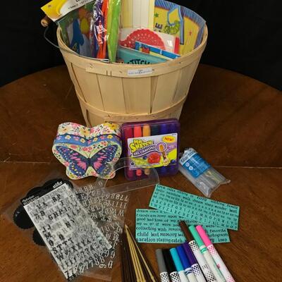 crafts: paint brushes, letter sticker, markers,glue sticks, gel crayons, butterfly box, and more in basket;