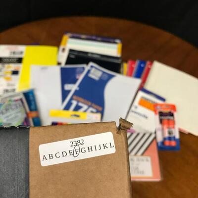 office/school supplies: packs of filler paper, notebook paper,glue sticks, pencils,pens;