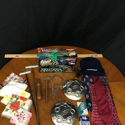 man cave: misc. tools, center caps (ford), handkerchiefs, model car, beanie, ties with hanger, cards;