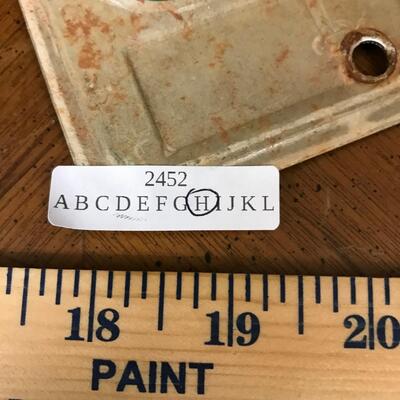 wall decor: ford, thunderbird, triumph motorcycle tags and car signage;