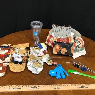 kitchen : hand towels, oven mitts, measuring spoons, reusable cup w/ 2 metal straws, spatula, herb garden markers, bowl and brush;