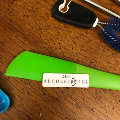 kitchen : hand towels, oven mitts, measuring spoons, reusable cup w/ 2 metal straws, spatula, herb garden markers, bowl and brush;