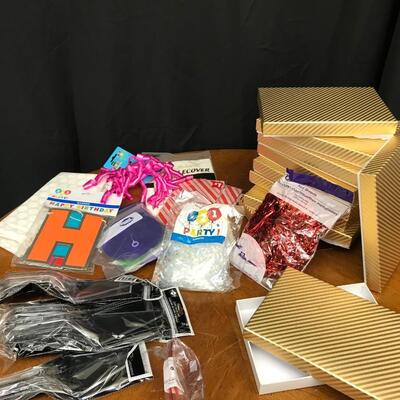 party supplies: gift boxes, happy birthday banner, gift bags, gift wrap materials;