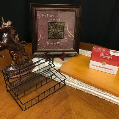 decor: Ceramic unicorn, shelf, campbell's recipe collection, rug, cutting board;