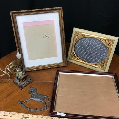 decor: 3 picture frames, cast iron horse, vintage frog lamp;