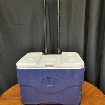 :1 Coleman Blue cooler, white lid on wheels;