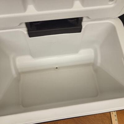 :1 Coleman Blue cooler, white lid on wheels;